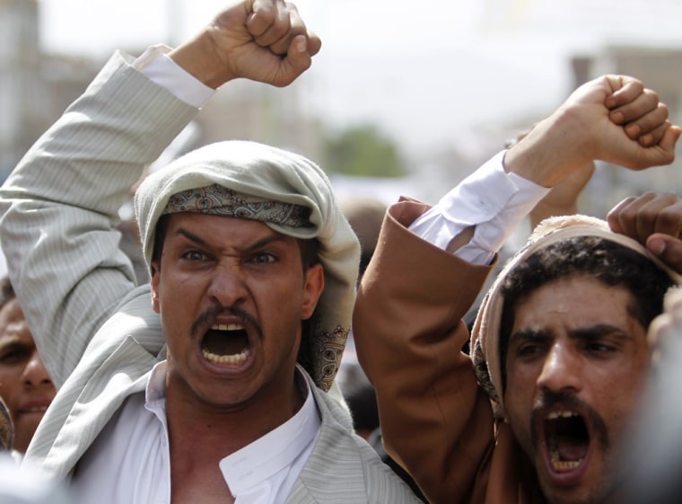Image: Protesters shout slogans during a protest on a road leading to the U.S. embassy in Sanaa