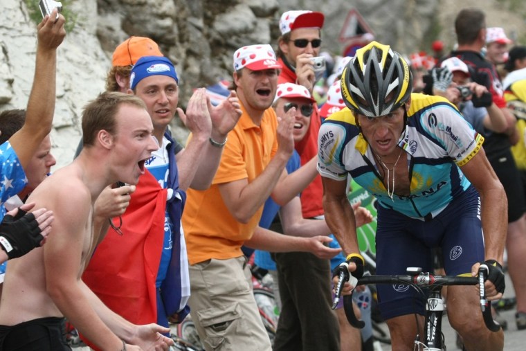Image: Lance Armstrong is cheered by fans