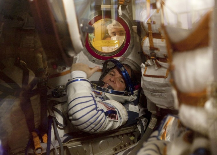 Image: The International Space Station (ISS) crew member U.S. astronaut Kevin Ford is seen inside the Soyuz spacecraft during training at Baikonur cosmodrome