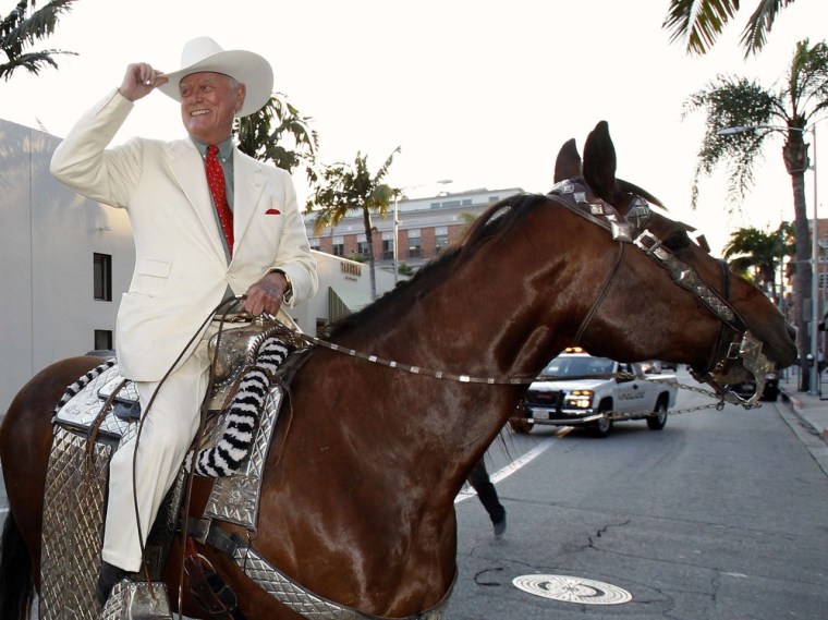 Image: File photo of Hagman riding a horse as he arrives for a VIP preview party for the Collection of Larry Hagman at Julien's Auctions in Beverly Hills