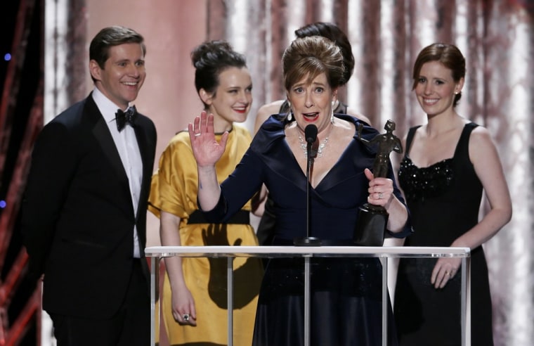 Image: Actress Phyllis Logan accepts the the award for outstanding ensemble in a drama series for \"Downtown Abbey\" at the 19th annual Screen Actors Guild Awards in Los Angeles
