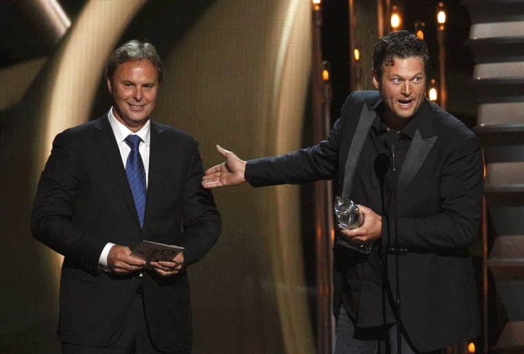 Image: Shelton accepts the award for album of the year for \"Based on a True Story\" with his producer Hendricks at the 47th Country Music Association Awards in Nashville, Tennessee