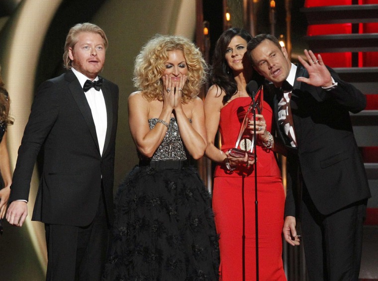 Image: Philip Sweet, Kimberly Schalpman, Karen Fairchild and Jimi West of Little Big Town accept the award for Vocal Group of the Year at the 47th Country Music Association Awards in Nashville