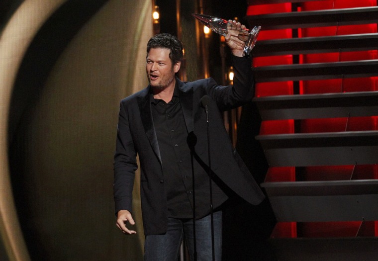 Image: Blake Shelton accepts the award for male vocalist of the year at the 47th Country Music Association Awards in Nashville, Tennessee