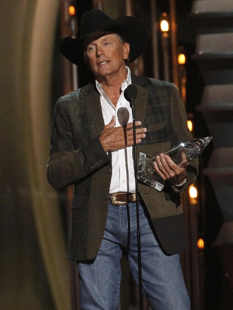 Image: George Strait accepts the award for entertainer of the year at the 47th Country Music Association Awards in Nashville, Tennessee
