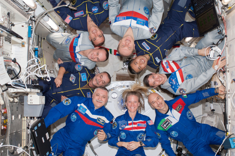 Image:Nine crew members gather for a group portrait in the International Space Station’s Kibo laboratory