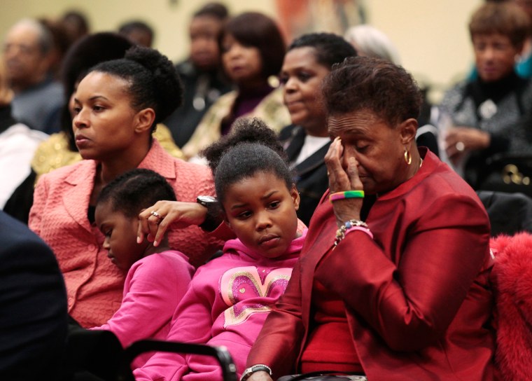 Image: People attend a public meeting where a moment of silence was held in memory of former South African President Mandela in Detroit