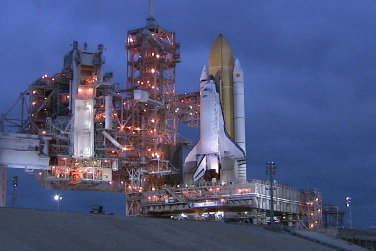 The shuttle Discovery sits on its launch pad at NASA's Kennedy Space Center in preparation for an April 5 launch.