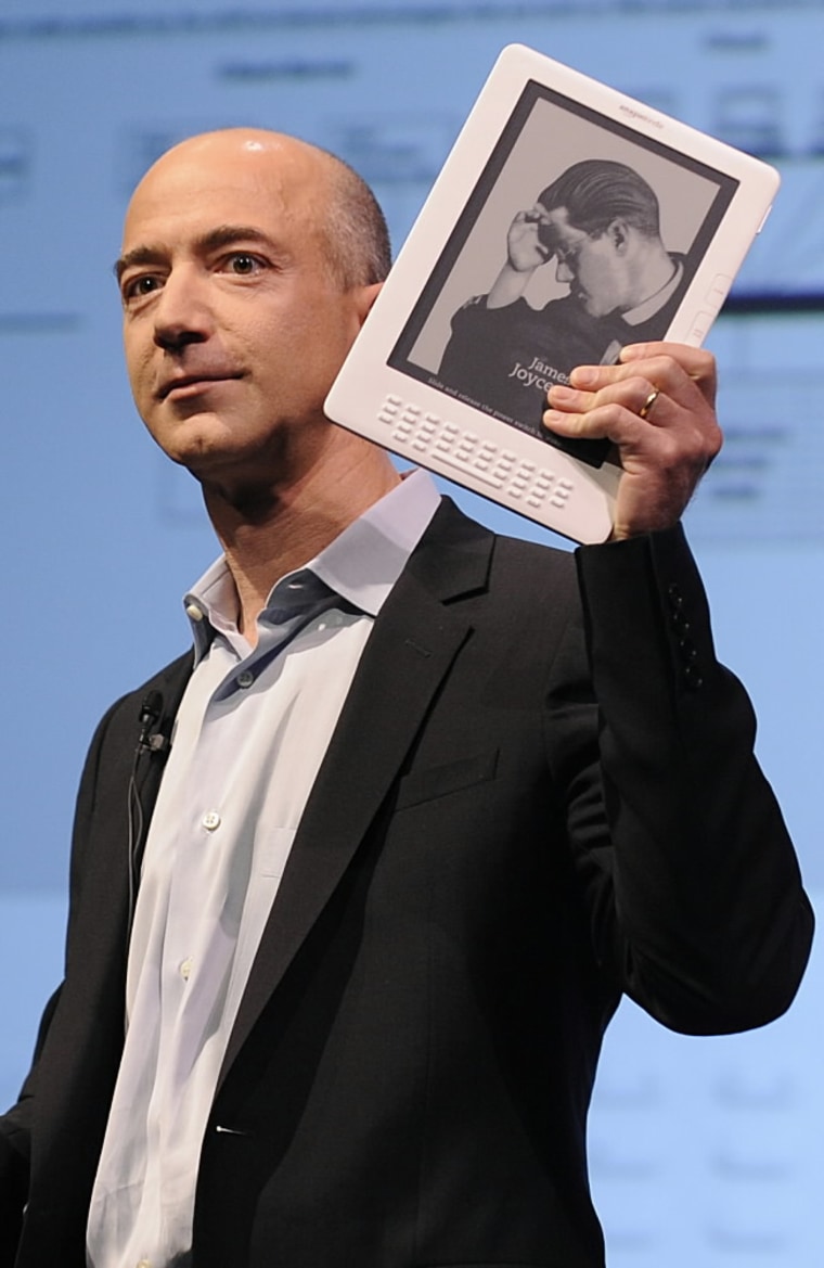 Amazon.com CEO Jeff Bezos unveils the Kindle DX, a large-screen version of its popular Kindle electronic reader designed for newspapers, magazines and textbooks, during a press conference in New York on May 6. 
