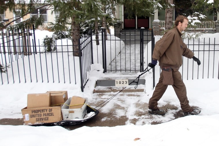 Image: UPS employee pulls a sled