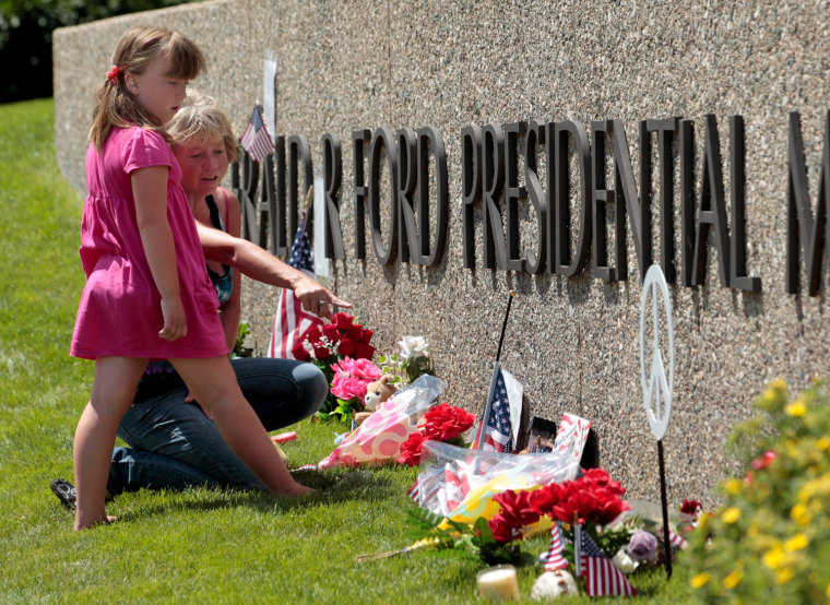 Image: People outside the Gerald Ford Museum before the funeral for former US First Lady Betty Ford