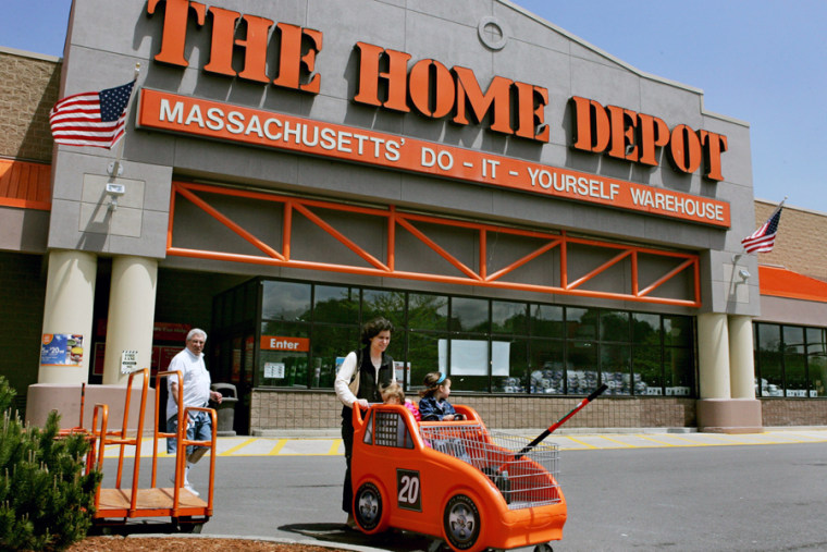 Image: Shoppers leave The Home Depot