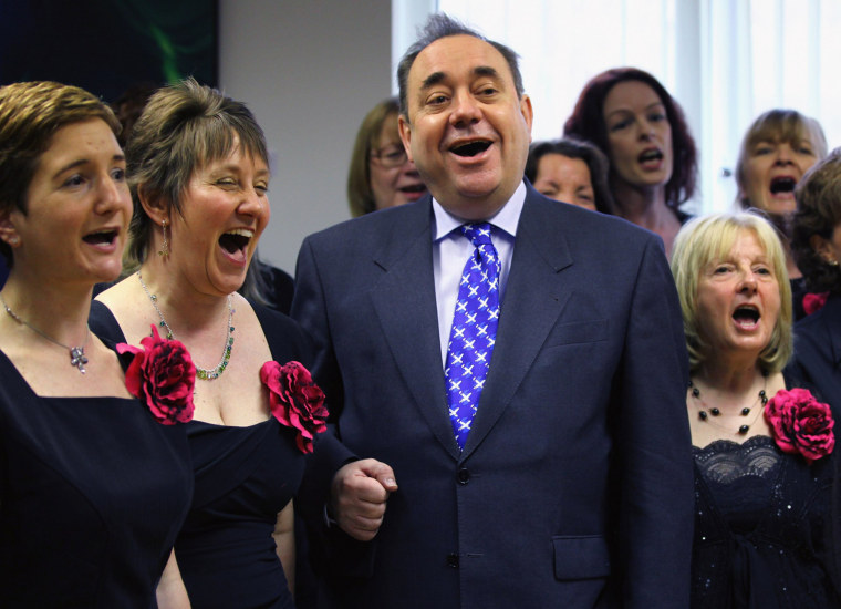 Image: Scotland's First Minister Alex Salmond sings with a choir on the campaign trail.