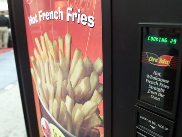 French Fries cook up in 45 seconds inside a vending machine made by R. O. International during the National Automatic Merchandising Association show at the Las Vegas Convention Center in Las Vegas Thursday, March 29, 2001. About 6,000 vending operators are attending the show at the Las Vegas Convention Center, where 250 exhibitors displayed their latest food products, trends and technology. (AP Photo/Lori Cain)
