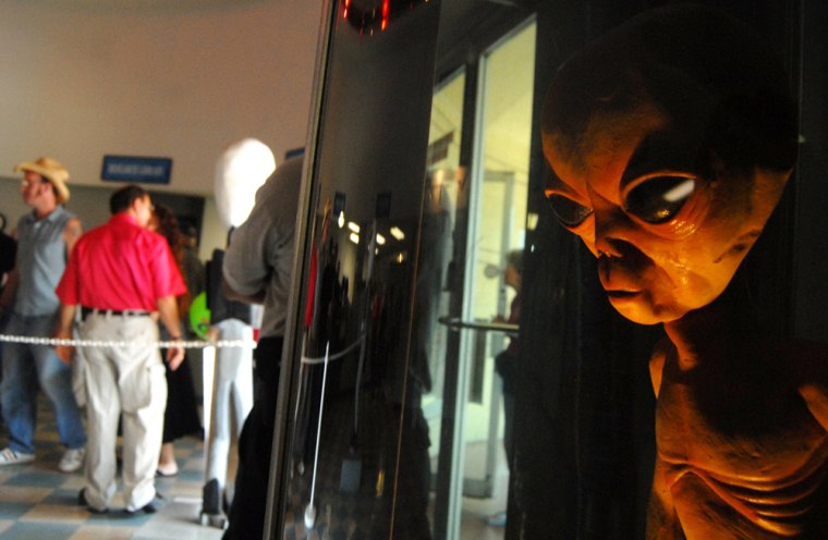 People file into the International UFO Museum and Research Center in Roswell, New Mexico Thursday, July 2, 2009 on the first day of the UFO Festival. 
