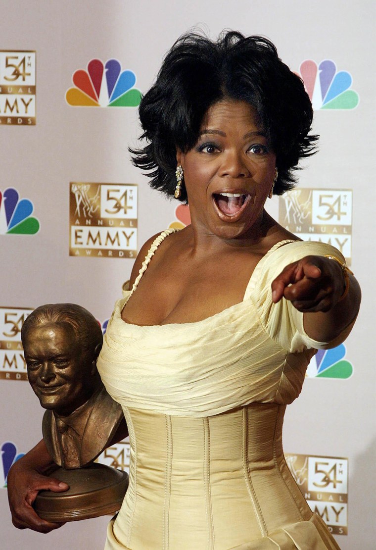 Us talk show host Oprah Winfrey poses after winnin