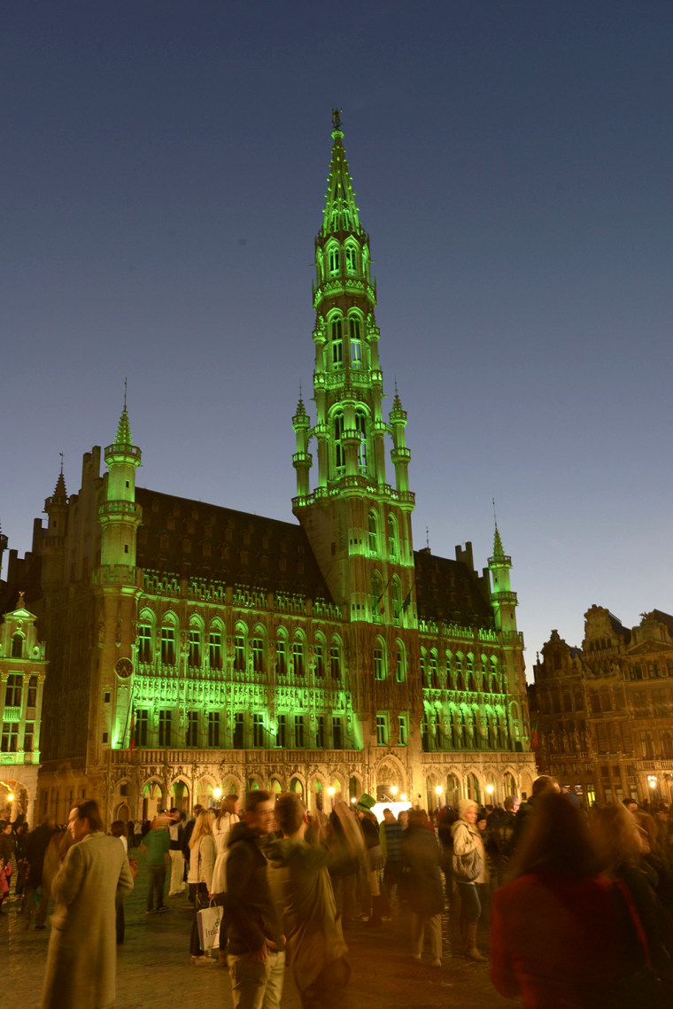 Image: The Brussels Grand Place is lit in green on the occasion of St. Patrick's Day