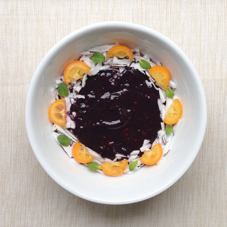 Blackberry smoothie bowl with coconut flakes and kumquat. Feb. 18, 2014