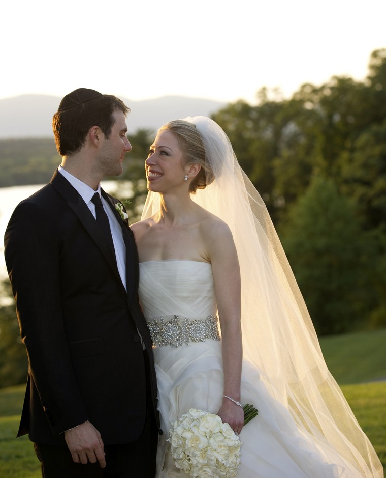 Image: Chelsea Clinton looks at Marc Mezvinsky after their wedding ceremony at Astor Court in Rhinebeck
