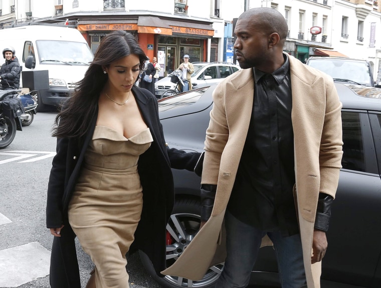 Image: TV personality Kim Kardashian and rapper Kanye West arrive at a fashion designer workshop in Paris