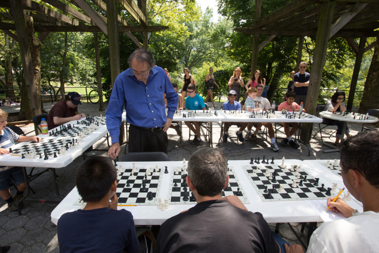 Chess and Checkers House in Central Park (located just beyond the Dairy from the Mall). The Chess and Checkers House offers boards and playing pieces for loan to anyone wishing to play the most pensive of games around. On certain summer Saturdays (this year it's 6/21, 7/12, and 8/23) the tables are set up to accommodate people looking to play a grand master instructor. He (or she) moves from player to player, watches each opponent make his/her move, makes a counter move, occasionally offers a comment, and moves on to the next player.  (Registration begins until 10 am, limited space, there's a half hour lecture, and then the games begin.)