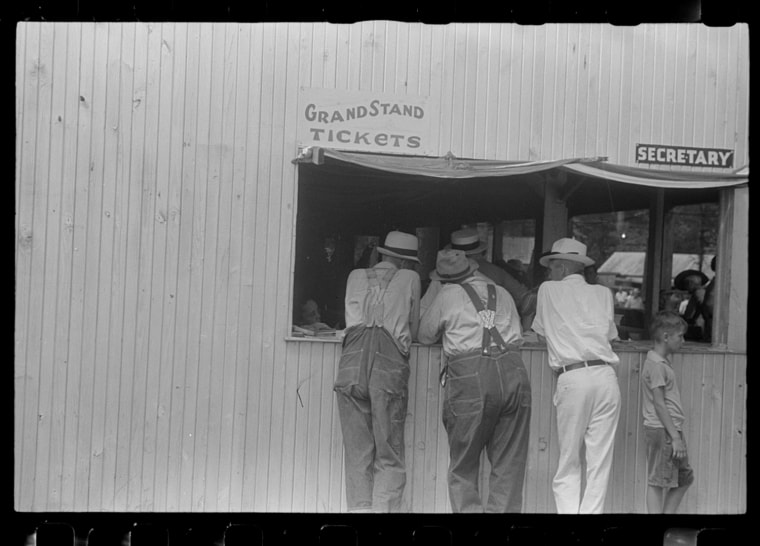 Purchasing tickets at county fair, central Ohio 1938