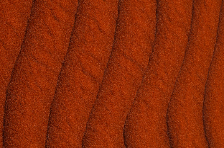 RIPPLES IN RED SAND
