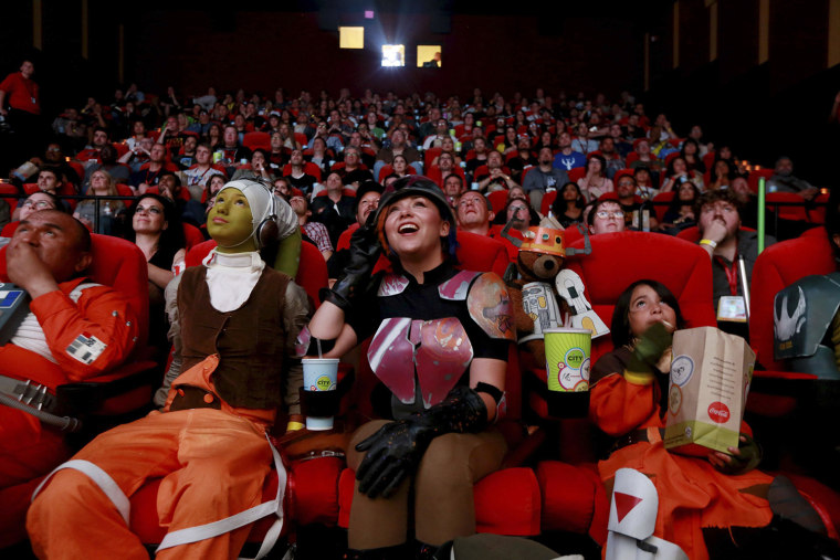 Image: Costumed attendees cheer as they meet the cast of Star Wars Legends during an advanced screening during the 2014 Comic-Con International Convention in San Diego, California