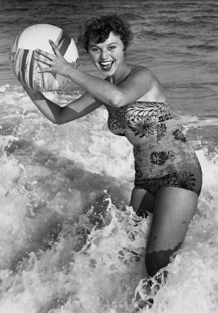 Woman in water w/beachball