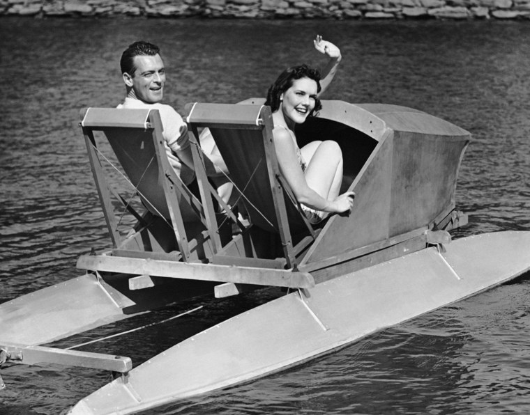 Couple on lake in paddle boat