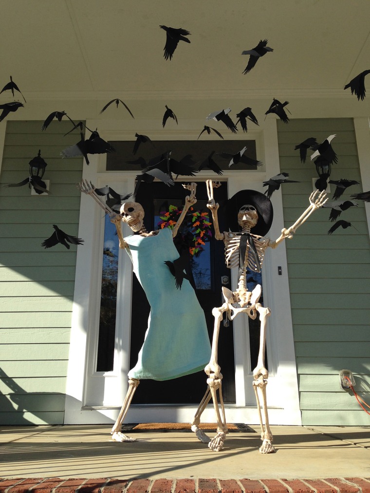Couple Decorates House With Skeleton Scenes