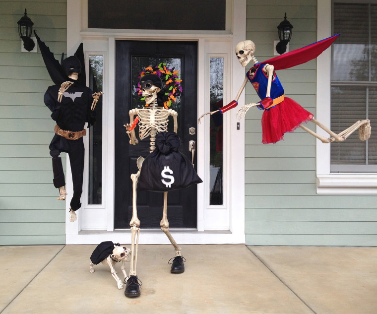 Couple Decorates House With Skeleton Scenes