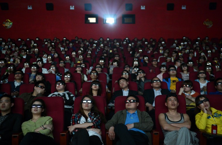 Image: People wearing 3D glasses watch the film \"Titanic 3D\" at a movie theatre in Taiyuan