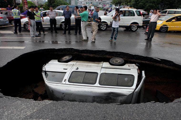 Image: Mini Van Swallowed By Street In Guangxi, China