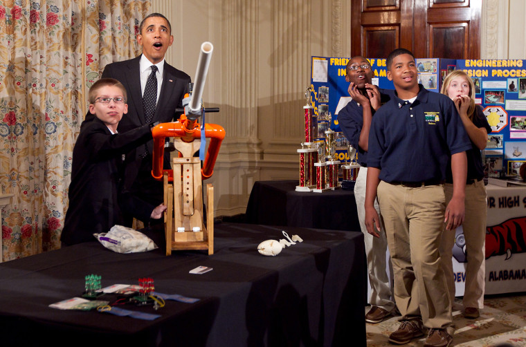 Image: President Barack Obama watches as Joey Hudy, 14, launches a marshmallow from his Extreme Marshmallow Cannon at the White House.