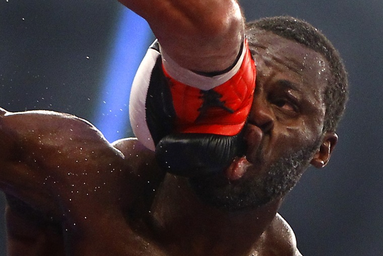 Image: Challenger Cunningham of the U.S. takes a heavy punch from Hernandez of Cuba during their IBF cruiserweight World Championship title re-match in Frankfurt