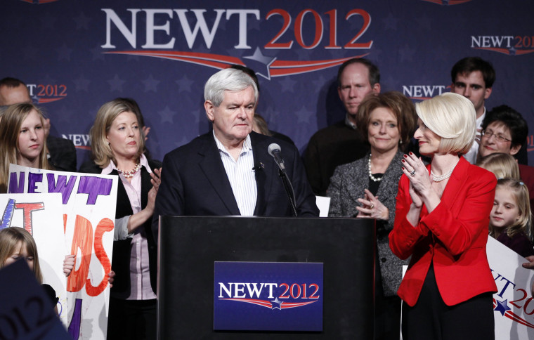 Image: Republican presidential candidate and former Speaker of the House Newt Gingrich is applauded by his wife, Callista (R) at his Iowa Caucus night rally in Des Moines, Iowa