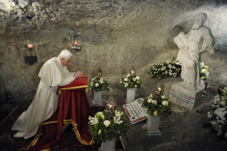 Image: File photo of Pope Benedict XVI praying inside St Paul's Grotto in Rabat