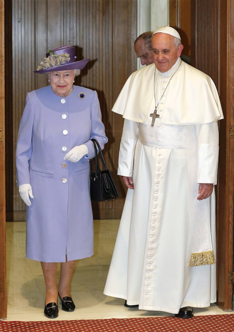 Image: Britain's Queen Elizabeth walks with Pope Francis during their meeting