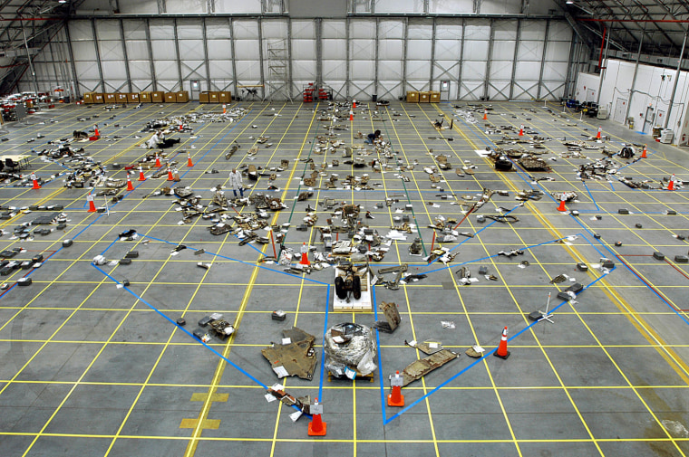 Image: NASA handout photo of Columbia debris in a hanger at Kennedy Space Center