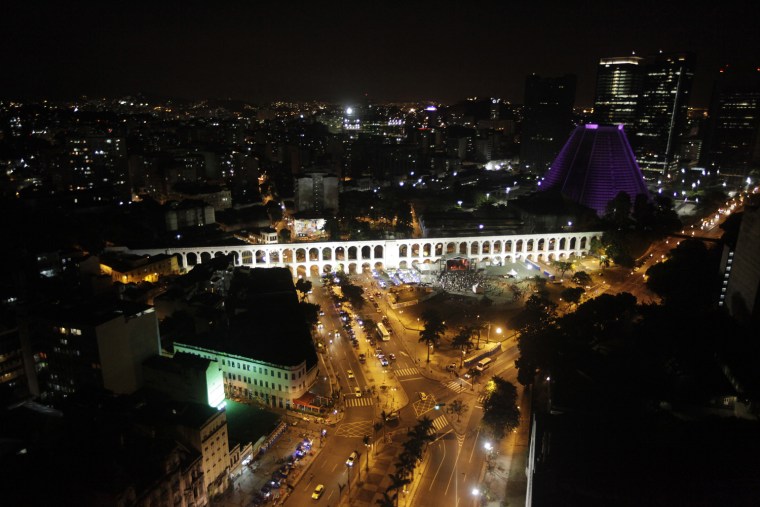 Image: Rio de Janeiro's Arcos da Lapa square is pictured before lights were turned off for Earth Hour