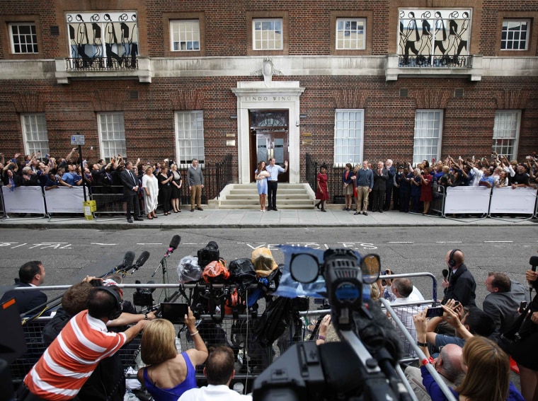 Image: Britain's Prince William and his wife Catherine, Duchess of Cambridge appear with their baby son, outside the Lindo Wing of St Mary's Hospital, in central London