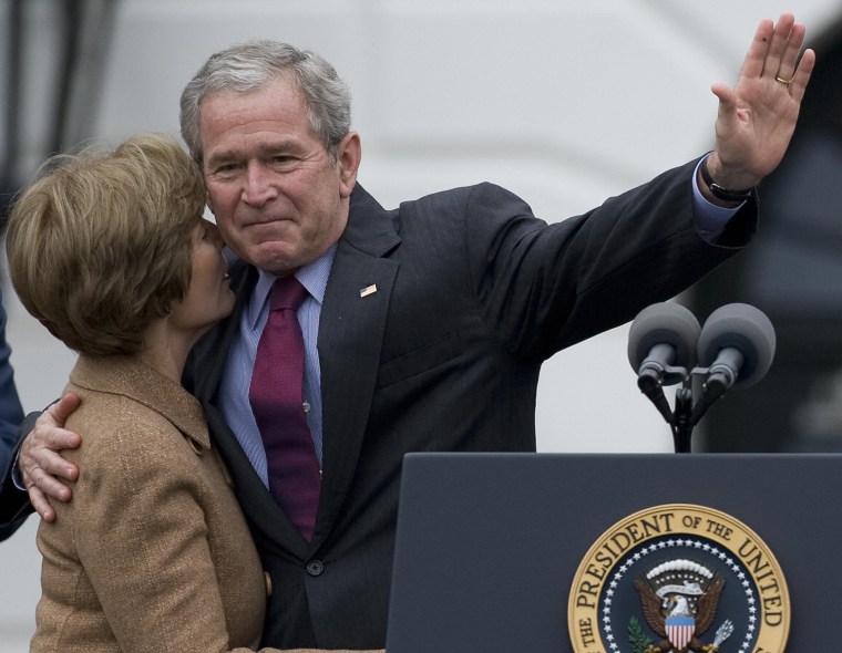 US President George W. Bush hugs First L