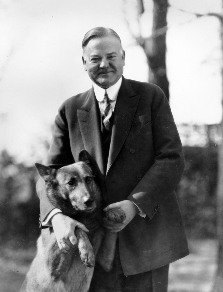 ** FILE ** President Herbert Hoover poses with his police dog, King Tut, in this undated photo. Supporters of the Depression-era president born in West Branch, Iowa, say they are growing tired of the negative attacks on a man they say was perhaps the greatest humanitarian of the 20th century. The Democrats say it over and over again and, each time, the folks in West Branch wince: President Bush is the first since Herbert Hoover to lose jobs on his watch. (AP Photo/Hoover Library)