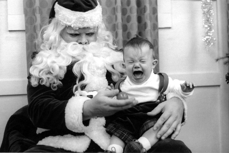 This is a picture of my son (now 12 years old), Graham Henderson, (at age 6 months).  The sceptical Santa was at our local grocery store. 1991 Janet Henderson 190 Washington Circle Lake Forest, IL 60045