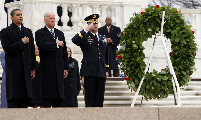 U.S. President-elect Barack Obama and Vice President-elect Joe Biden lay a wreath with Major Gen. Richard Rowe at the Tomb of the Unknowns at Arlington Cemetery in Arlington, Virginia