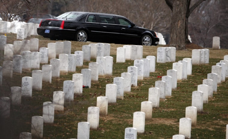 A U.S. Presidential limousine carrying U.S. Vice President-elect Joe Biden drives through Arlington Cemetery in Arlington