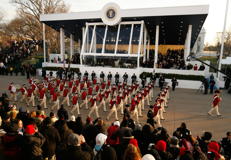 Red Coats marching band pass viewing stands during parade in honor of U.S. President Barack Obama in Washington