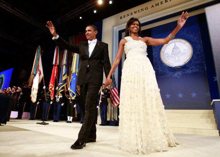 U.S. President Obama walks on stage with first lady Michelle during the Western States Inaugural Ball in Washington