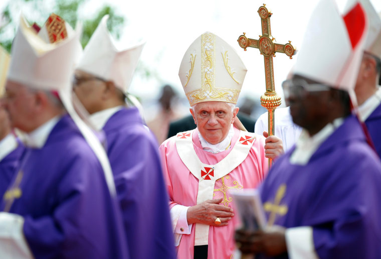 Pope Benedict XVI arrives in procession for a mass at the Cimangola open ground in the outskirts of Luanda